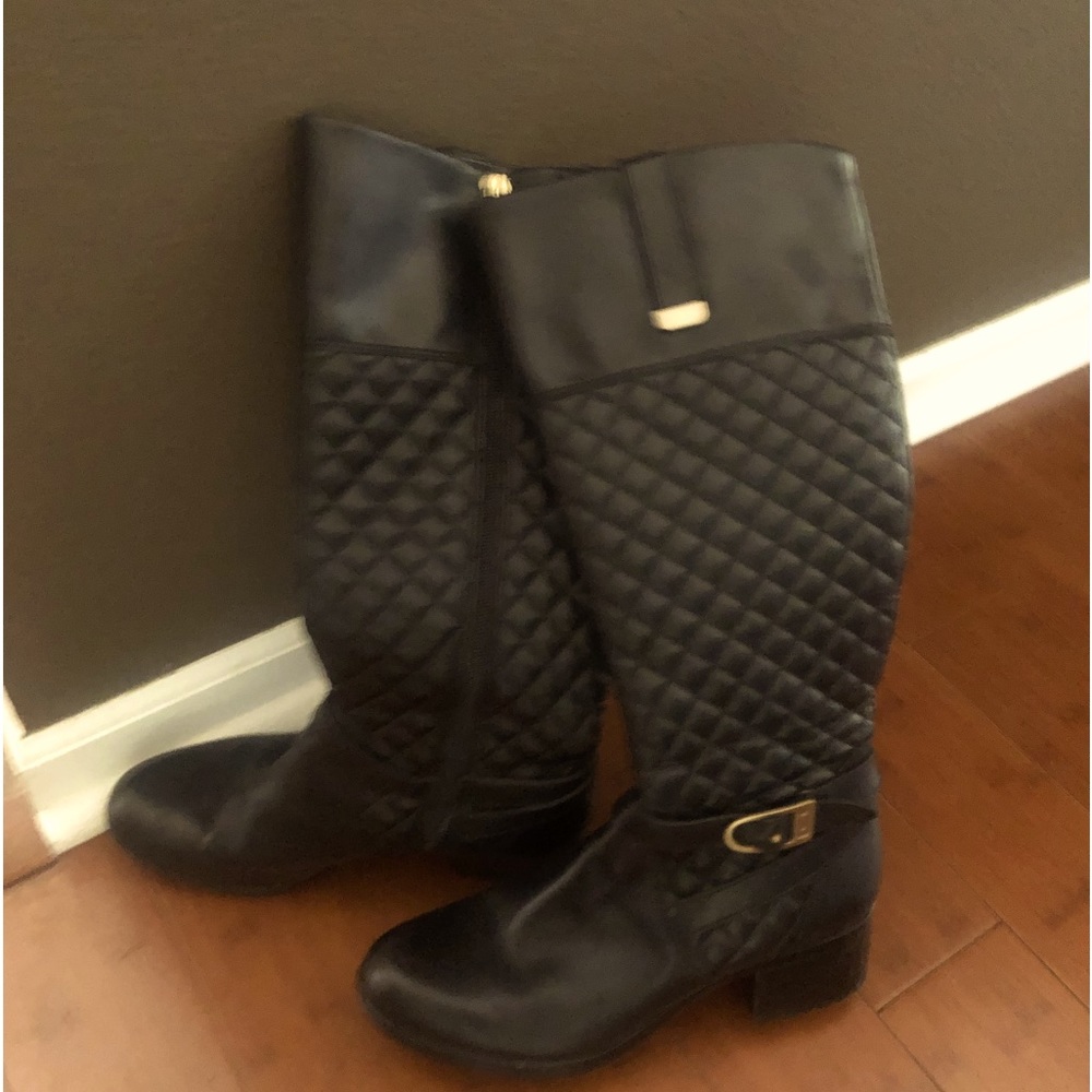 Black quilted riding boots.